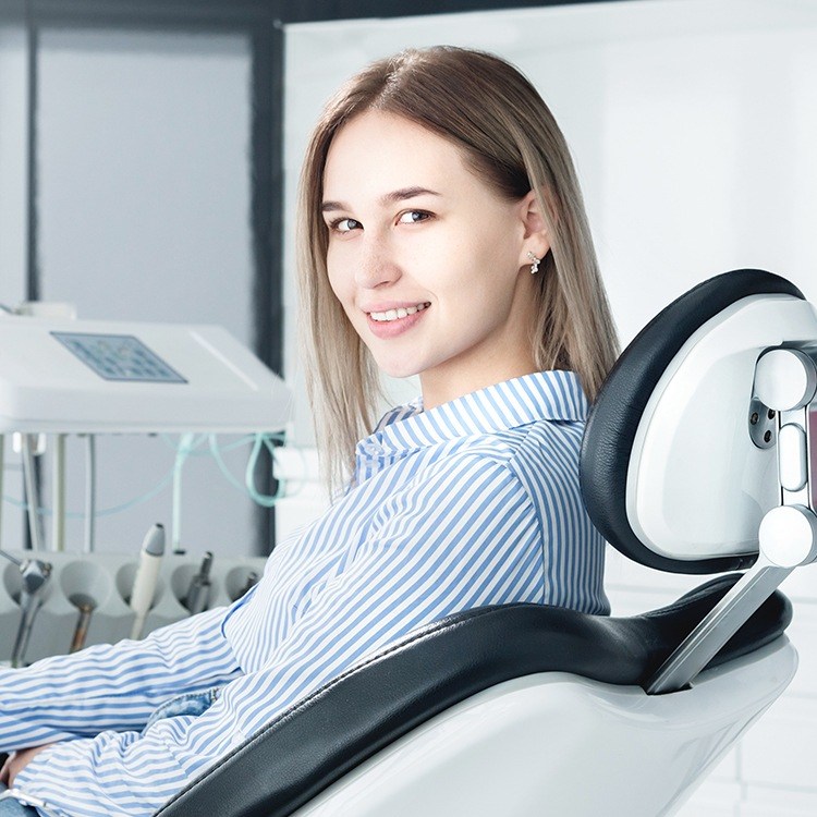 Woman in dental chair during preventive dentistry appointment