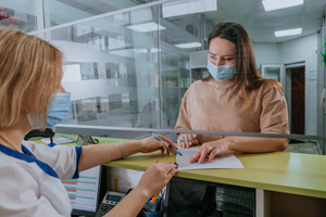 Patient in Boerne filling out paperwork for cosmetic dentistry